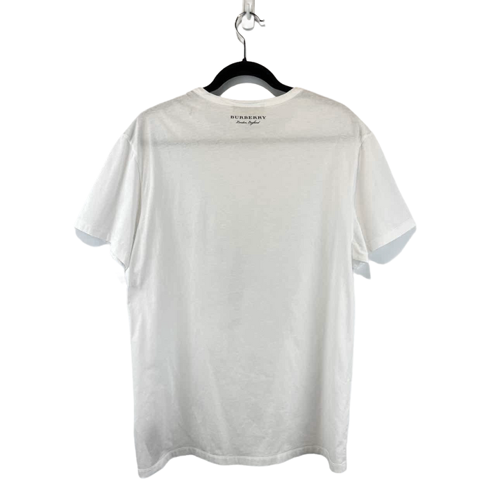 a white t - shirt hanging on a hanger