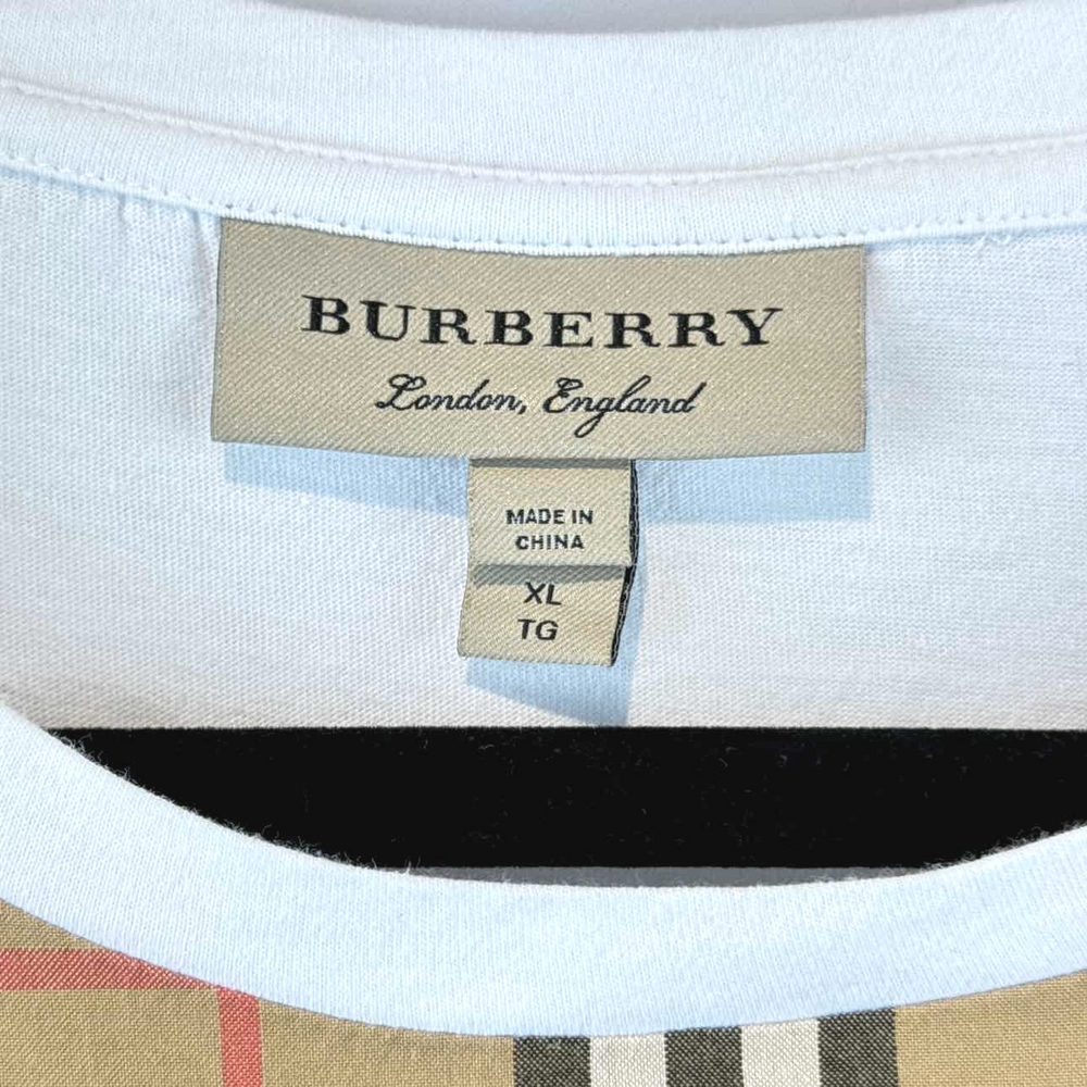 a burbery shirt with a tag on it